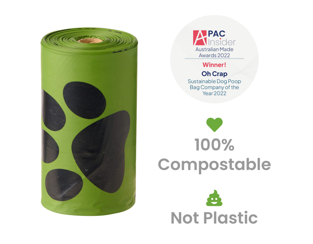 Image of a oh crap non plastic poop bag roll, showing the award logo saying it's sustainable dog poop bag of the year 2022 & the words 100% compostable and not plastic
